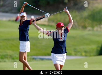 Europe's Carlota Ciganda, right, from Spain, celebrates with her playing  partner, Azahara Munoz, from Spain, after they won a four-ball match  against Paula Creamer and Lexi Thompson of the United States at