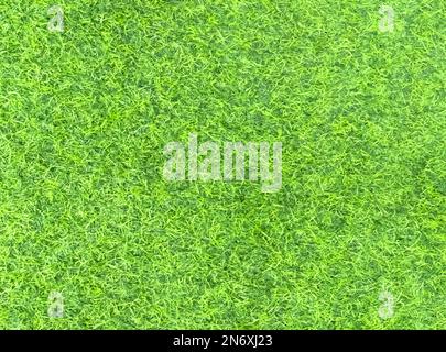 Artificial grass lawn texture. Artificial Turf Background. Greening with an artificial grass. Artificial turf laying background texture. Synthetic gra Stock Photo
