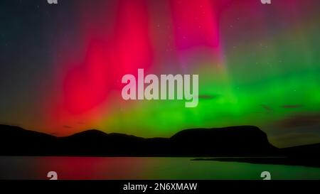 The aurora borealis over Loch Brora in Sutherland Stock Photo