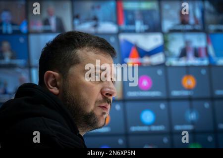 Kyiv, Ukraine. 10th Feb, 2023. Ukrainian President Volodymyr Zelenskyy, left, delivers remarks during an online summit by video link with the International Olympic Committee from the Mariyinsky Palace, February 10, 2022 in Kyiv, Ukraine. Zelenskyy has called for a total ban of all Russian athletes from the 2024 Summer Olympic Games. Credit: Ukraine Presidency/Ukrainian Presidential Press Office/Alamy Live News Stock Photo