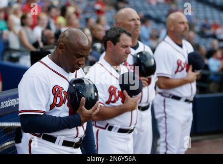 FILE - In this Sept. 30, 1969, file photo, a Major League Baseball 100th  anniversary patch is shown on the uniform of Atlanta Braves team captain  Hank Aaron, left, as he watches