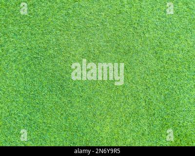 Artificial grass lawn texture. Artificial Turf Background. Greening with an artificial grass. Artificial turf laying background texture. Synthetic gra Stock Photo