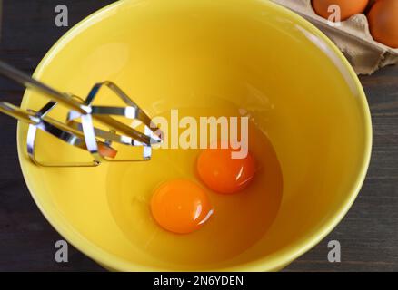 Closeup of a Pair of Raw Eggs in Mixing Bowl Going to be Beaten Stock Photo