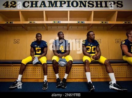 Michigan cornerback Courtney Avery (5), linebacker Cameron