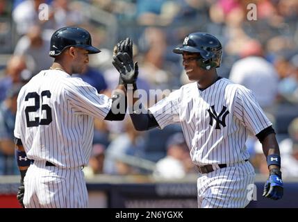 New York Yankees on-deck batter Erik Kratz (38) celebrates with teammate  Thairo Estrada, right, after Estrada hit a solo home run during the fourth  inning of a baseball game, Monday, Aug. 17