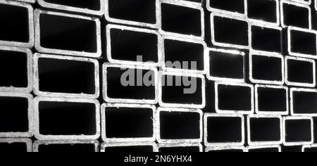 Metal profile manufacturing. Structural metal shapes.Metal profiles texture. Metal constructions factory. Stock Photo
