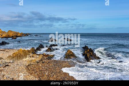 Sandend Village Aberdeenshire Scotland pebble beach rocks and sea Stock Photo