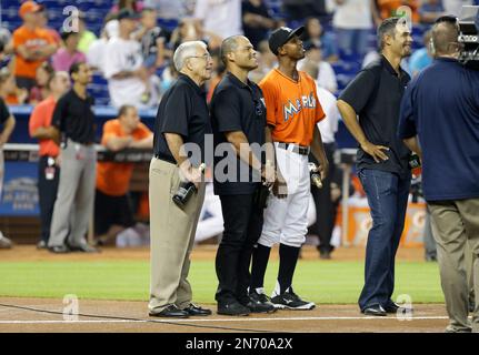 Former Miami Marlins' Juan Pierre throws the ball to home plate