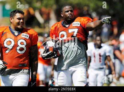 Cleveland Browns defensive tackle Malik Jackson (97) and defensive end  Myles Garrett (95) walk off the field after an NFL football game against  the Denver Broncos, Thursday, Oct. 21, 2021, in Cleveland.