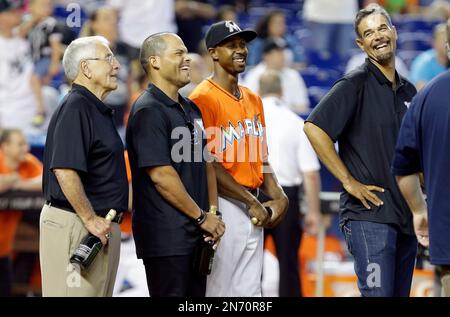 Former Miami Marlins' Juan Pierre throws the ball to home plate