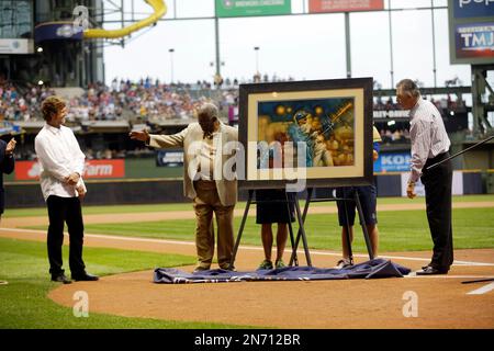 Former Milwaukee Brewers Robin Yount and Rollie Fingers, right, watch a  video from the dugout at a ceremony commemorating Yount's 20 years since  retirement before a baseball game against the Washington Nationals