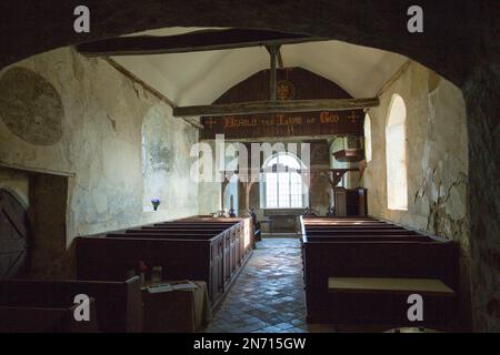 View of interior architecture of the disused Anglican church of St Marys at Mundon in Essex, including 18th-century box pews and octagonal pulpit. Stock Photo