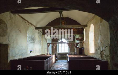 View of interior architecture of the disused Anglican church of St Marys at Mundon in Essex, including 18th-century box pews and octagonal pulpit. Stock Photo