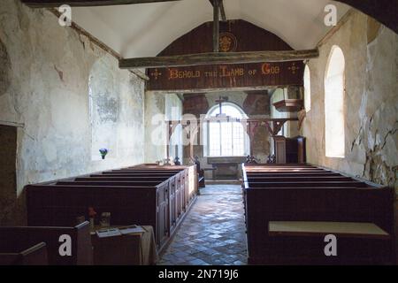 View of interior architecture of the disused Anglican church of St Marys at Mundon in Essex, including 18th-century box pews and octagonal pulpit. Stock Photo