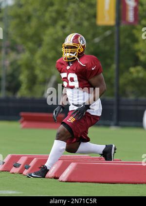 Washington Redskins inside linebacker London Fletcher (59) celebrates an  interception in the end zone during the third quarter of an NFL football  game against the St. Louis Rams in St. Louis, Sept …