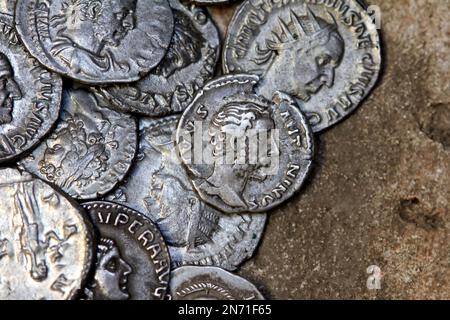 Roman silver denarii coins showing portraits of various emperors Stock Photo