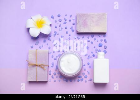 Flat lay composition with spa items on violet background Stock Photo