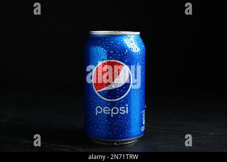 MYKOLAIV, UKRAINE - FEBRUARY 08, 2021: Can of Pepsi with water drops on black table Stock Photo
