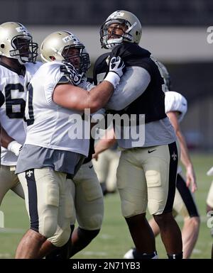 New Orleans Saints center Brian De La Puente (60), guard Ben Grubbs (66),  tackle Scott Winnewisser (78), and tackle Hutch Eckerson (79) watch drills  during training camp at their NFL football training