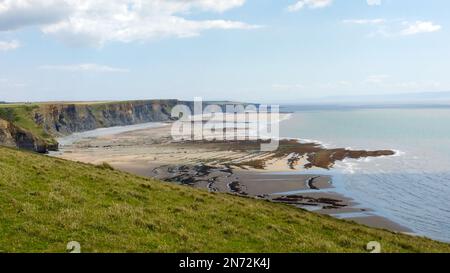 Dunraven Bay - Far out tide and clear skies on Welsh coastline near Southerndown and Ogmore-by-sea in South Wales, United Kingdom. Stock Photo