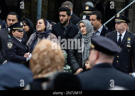 New York, United States. 09th Feb, 2023. PO Adeed Fayaz wife, two boys and mother seen at his funeral at the Makki Masjid Muslim Community Center in Brooklyn. PO Fayaz was killed in a botched robbery while he tried to buy a car, he was off duty at the time. (Photo by Lev Radin/Pacific Press) Credit: Pacific Press Media Production Corp./Alamy Live News Stock Photo