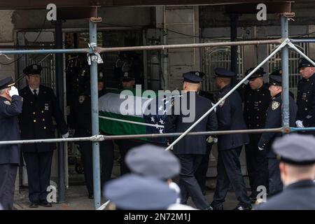 New York, United States. 09th Feb, 2023. PO Adeed Fayaz wife, two boys and mother seen at his funeral at the Makki Masjid Muslim Community Center in Brooklyn. PO Fayaz was killed in a botched robbery while he tried to buy a car, he was off duty at the time. (Photo by Lev Radin/Pacific Press) Credit: Pacific Press Media Production Corp./Alamy Live News Stock Photo