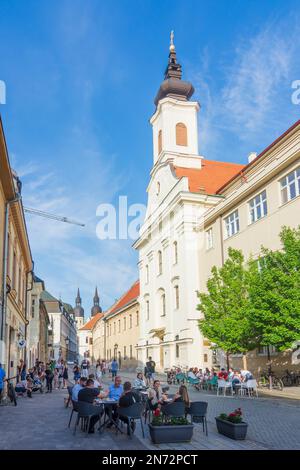 Trnava (Tyrnau), restaurant in Old Town, Kostol svätej Anny (Church of St. Anne) in Slovakia Stock Photo