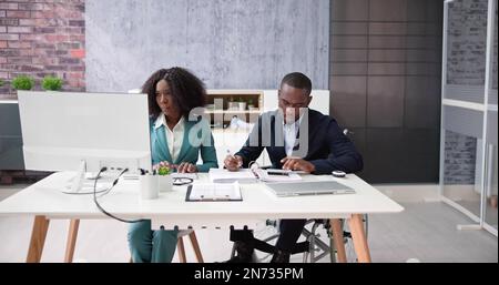 Accountant Business Advisory In Office. Man And Woman Stock Photo