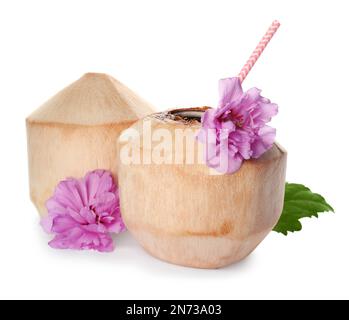 Young peeled coconuts with straw, leaf and beautiful flowers on white background Stock Photo