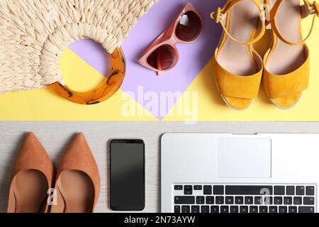 Flat lay composition with business items and vacation accessories on color background. Concept of balance between work and life Stock Photo
