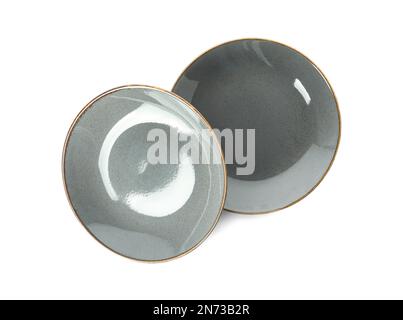 New grey ceramic plates on white background Stock Photo