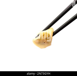 Chopsticks with pickled ginger on white background Stock Photo