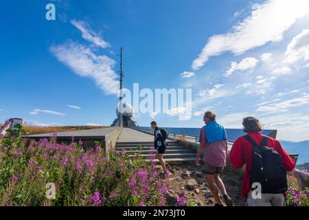 Vosges (Vogesen) Mountains, hiker at mountain Grand Ballon (Großer Belchen), air traffic control radar station in Alsace (Elsass), Haut-Rhin (Oberelsass), France Stock Photo