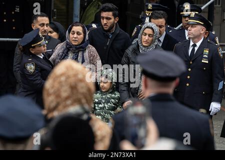 New York, New York, USA. 9th Feb, 2023. PO Adeed Fayaz wife, two boys and mother seen at his funeral at the Makki Masjid Muslim Community Center in Brooklyn. PO Fayaz was killed in a botched robbery while he tried to buy a car, he was off duty at the time. (Credit Image: © Lev Radin/Pacific Press via ZUMA Press Wire) EDITORIAL USAGE ONLY! Not for Commercial USAGE! Stock Photo