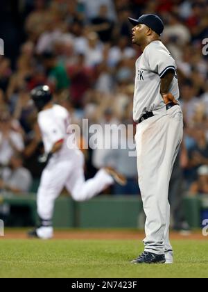 Boston Red Sox's Jonny Gomes (L) congratulates Mike Napoli after