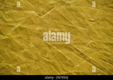 Abstract yellow gold background crumpled fabric Stock Photo