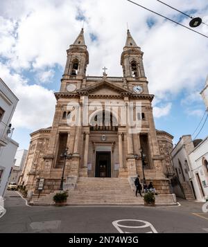 Scenic portal of Basilica of Saints Cosmas and Damian in Alberobello, Southern Italy Stock Photo