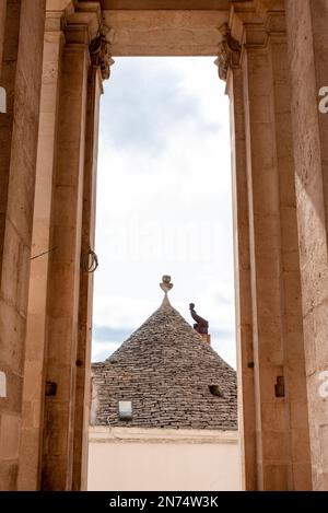 Scenic portal of Basilica of Saints Cosmas and Damian in Alberobello, Southern Italy Stock Photo