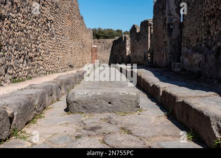 A crosswalk of a typical Roman road in the ancient city of Pompeii, Southern Italy Stock Photo