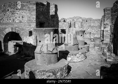 Millstones of a bakery in the ancient city of Pompeii, Italy Stock Photo