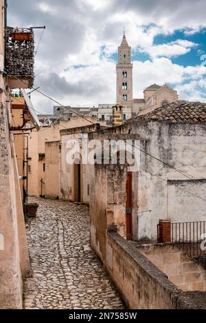 A narrow alley with cobblestones somewhere in the historic city of Matera, Southern Italy Stock Photo