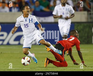 https://l450v.alamy.com/450v/2n758h4/honduras-midfielder-mario-berrios-15-is-tripped-up-by-trinidad-tobagos-kevin-molino-10-in-the-first-half-a-concacaf-gold-cup-soccer-match-on-monday-july-15-2013-in-houston-ap-photobob-levey-2n758h4.jpg