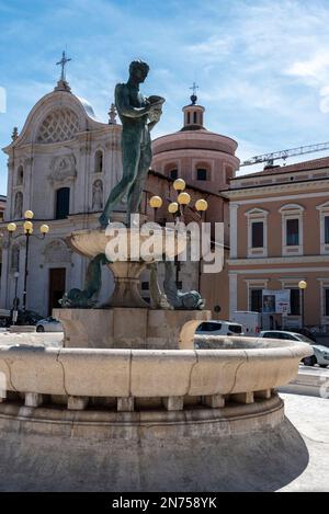 Fountain in front of the cathedral San Massimo in L'Aquila, Abruzzo in Italy Stock Photo