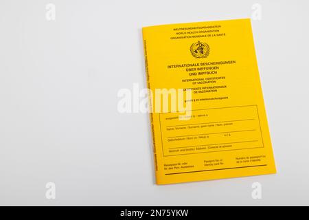 New international vaccination card, yellow, white background, Stock Photo
