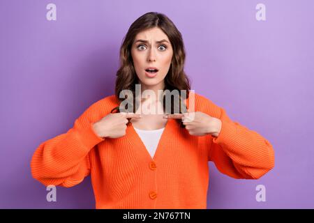 Photo of gloomy grumpy lady wear orange clothes arms showing herself impressed your choice isolated on purple color background Stock Photo