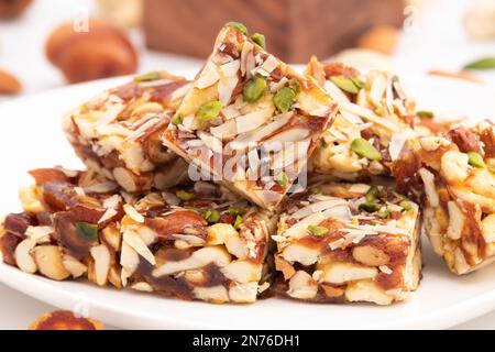 Khajur Barfi Or Khajoor Dry Fruits Burfi Made Of Dates, Anjeer, Kaju, Cashew Nuts, Raisins, Kismis, Pista, Poppy Seeds, Almonds, Pistachio, Badam, Maw Stock Photo