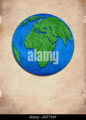 Paper cutout of globe. Creative concept of the world map created by old paper cutout. Stock Photo