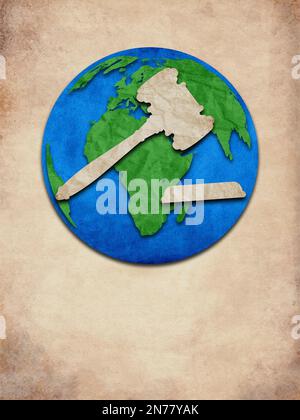 Paper cutout of globe. Creative concept of Law & Order in world created by old paper cutout. Stock Photo