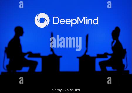 JAPAN, TOKYO. JANUARY 30, 2023: DeepMind from Google. A Glimpse into the Tech World: Silhouette of Software Developers with Company Logo Behind Them Stock Photo