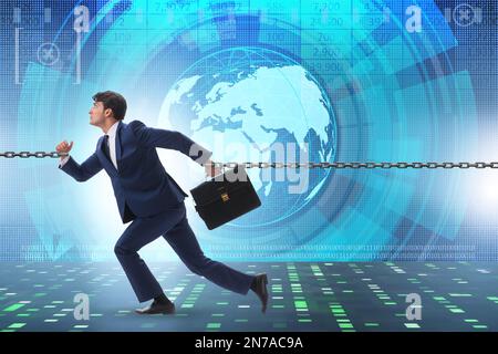 Chained businessman in the workaholic concept Stock Photo